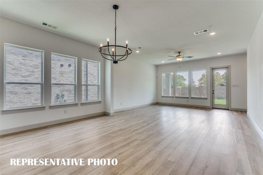 Windows everywhere you look in this wonderful home create a light and bright family room-dining area.  REPRESENTATIVE PHOT