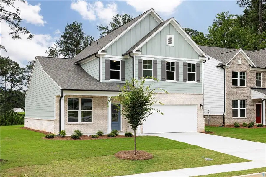 Front exterior of a new home in Riverside Ridge, Lawrenceville, GA, highlighting curb appeal (Image 19).