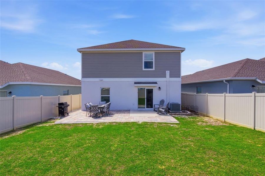 Exterior details and patio area of a home in Wellness Ridge, Clermont (Image 3).