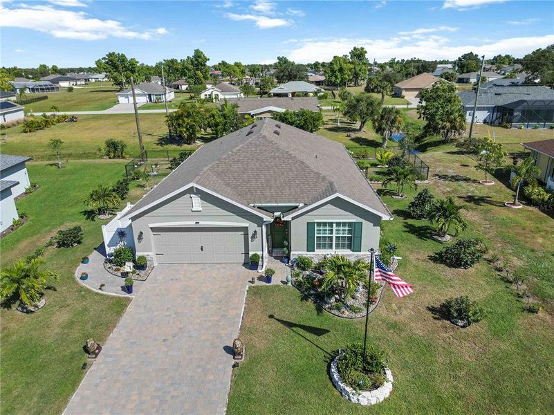 Front exterior of a new home in Burnt Store Village, Punta Gorda, FL, highlighting curb appeal (Image 23).