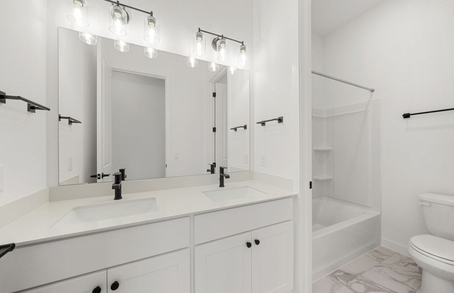 Representative furnished interior of a home built from the Dobbin by Pulte Homes in 6 Creeks, Kyle (Image 14).