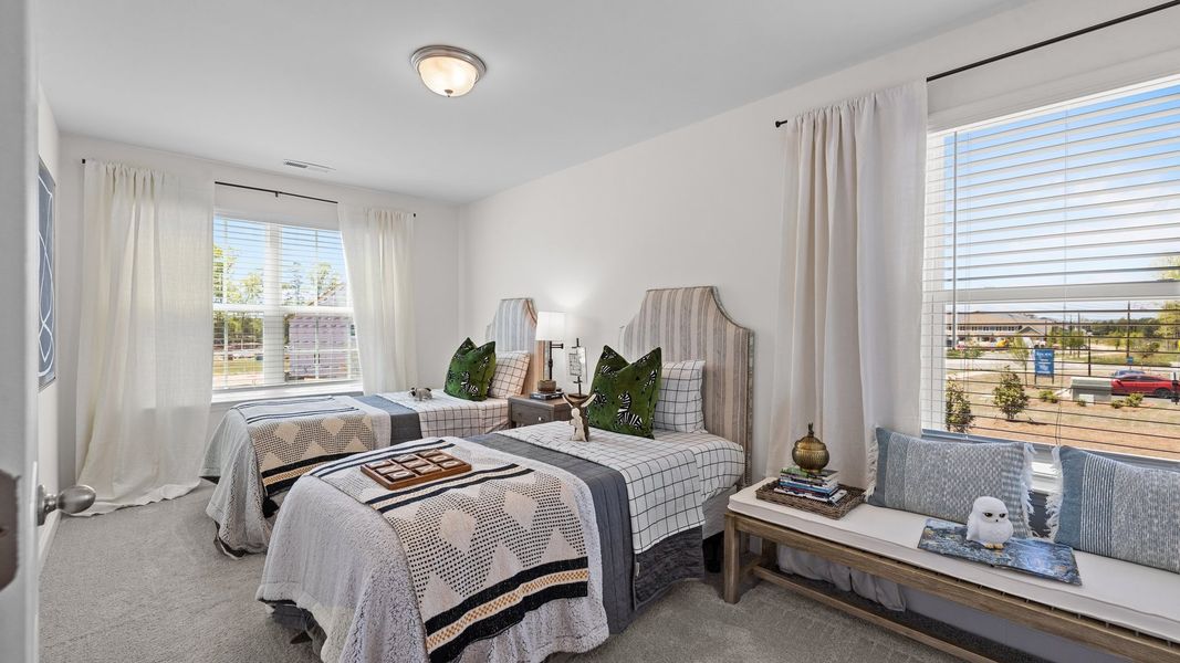Spacious corner bedroom with large windows and elevated ceiling in the Rochester Design by DRB Homes Charlotte, NC Spacious corner bedroom with large windows and elevated ceiling in the Rochester Design by DRB Homes Charlotte, NC