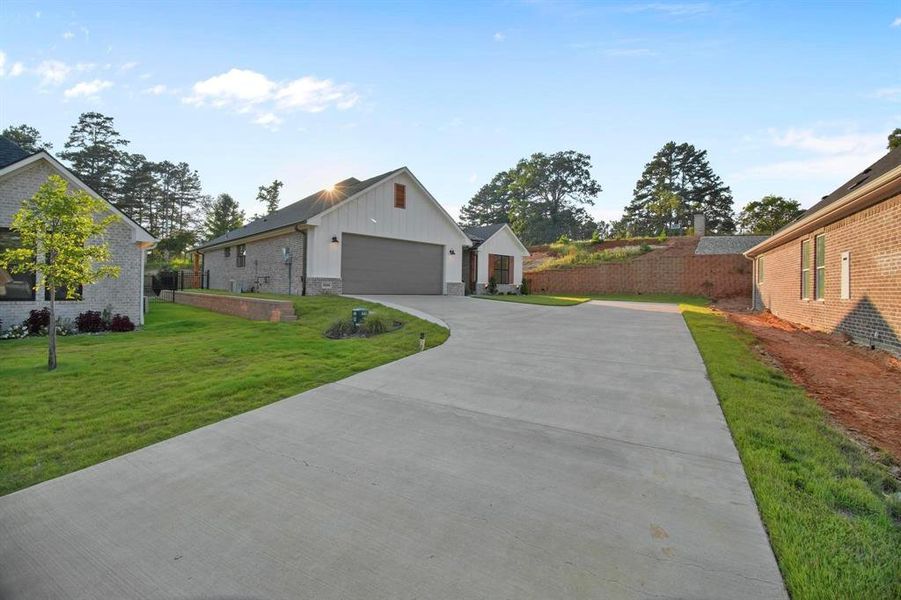 Front exterior of a new home in , Tyler, TX, highlighting curb appeal (Image 24).