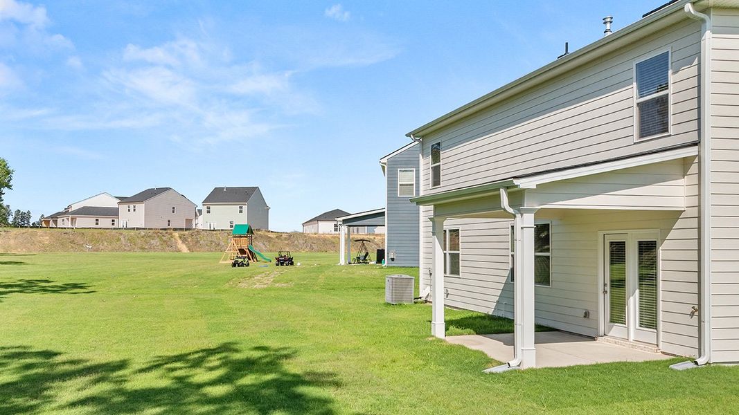 Exterior details and patio area of a home in Estates at Deer Hollow, Grovetown (Image 25).