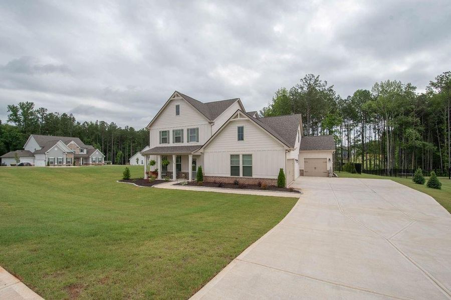 Front exterior of a new home in , Senoia, GA, highlighting curb appeal (Image 22). Front exterior of a new home in , Senoia, GA, highlighting curb appeal (Image 22).