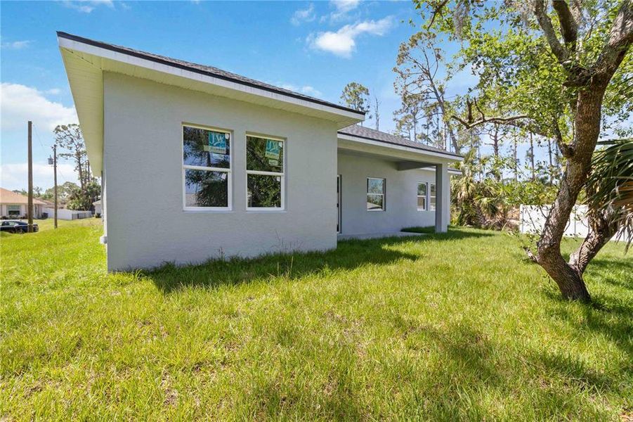 Front exterior of a new home in , North Port, FL, highlighting curb appeal (Image 17).