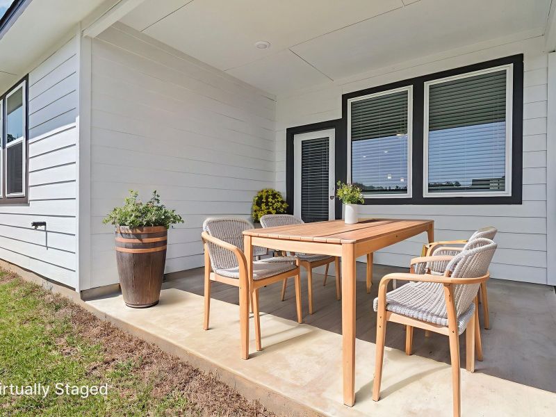 Exterior details and patio area of a home in Sanford Farms - Traditional Series, Waller (Image 2).