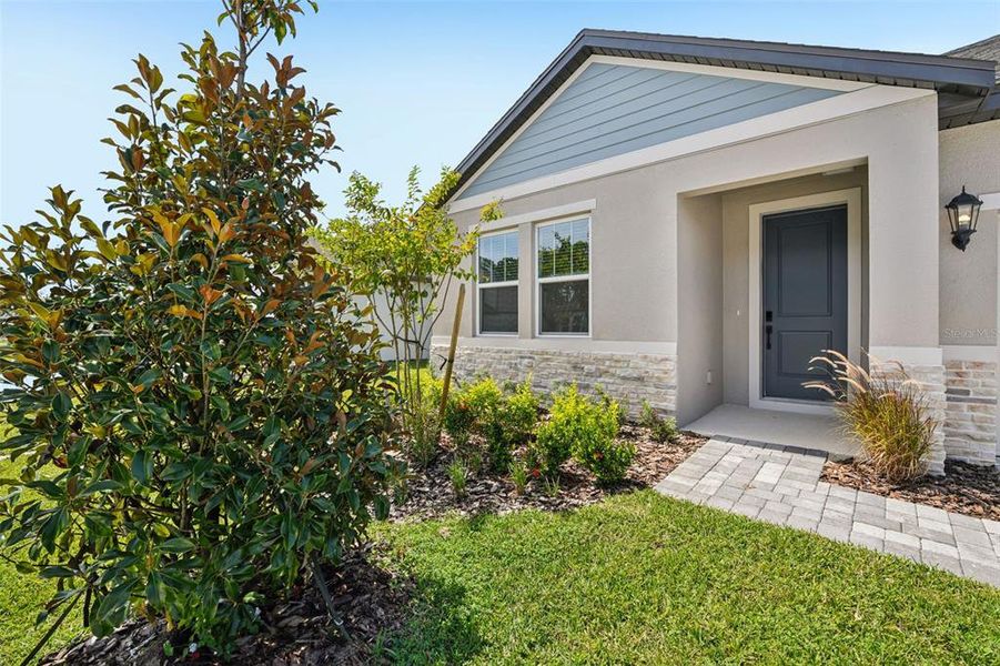 Exterior details and patio area of a home in Ridgehaven - Reserve Series, Ormond Beach (Image 4).