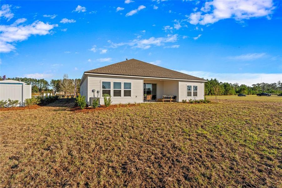 Front exterior of a new home in The Cypress Series at Reserve East, Flagler Beach, FL, highlighting curb appeal (Image 22). Front exterior of a new home in The Cypress Series at Reserve East, Flagler Beach, FL, highlighting curb appeal (Image 22).