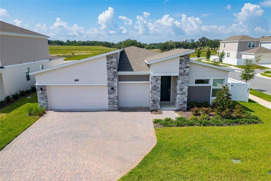 Front exterior of a new home in , Apopka, FL, highlighting curb appeal (Image 19).