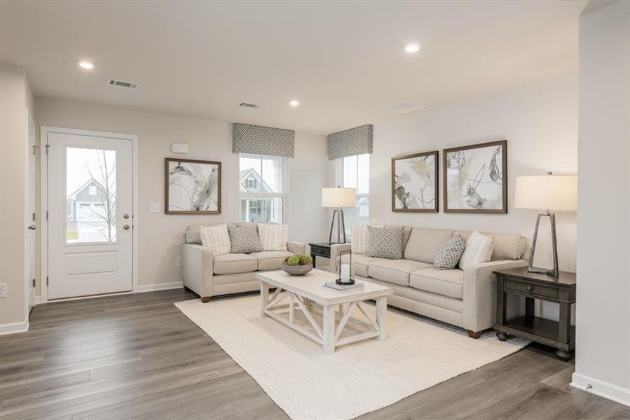 Representative furnished interior of a home built from the Tate by Ryan Homes in Middle Creek Village Coastal Cottages & Villas, Bolivia (Image 10).