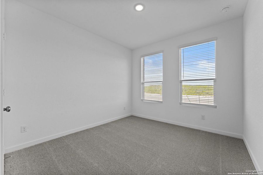 Spacious, unfurnished interior of a new home in Waterwheel: Coastline Collection, San Antonio (Image 15).