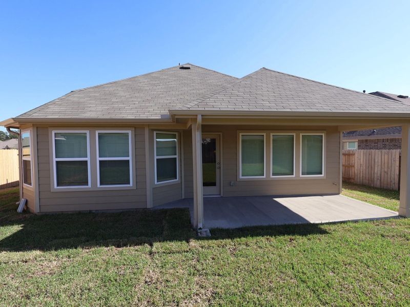 Exterior details and patio area of a home in Pinewood at Grand Texas, New Caney (Image 4). Exterior details and patio area of a home in Pinewood at Grand Texas, New Caney (Image 4).
