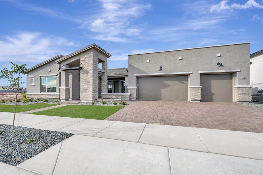 Front exterior of a new home in Suelo at Legado West, Queen Creek, AZ, highlighting curb appeal (Image 2). Front exterior of a new home in Suelo at Legado West, Queen Creek, AZ, highlighting curb appeal (Image 2).