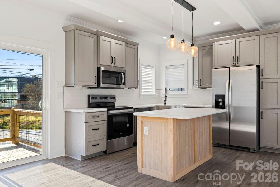 Two tone cabinetry w/ Pantry beside fridge