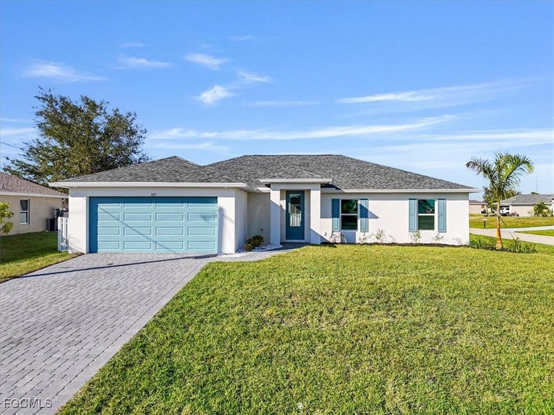 Front exterior of a new home in Cape Coral, Cape Coral, FL, highlighting curb appeal (Image 2).