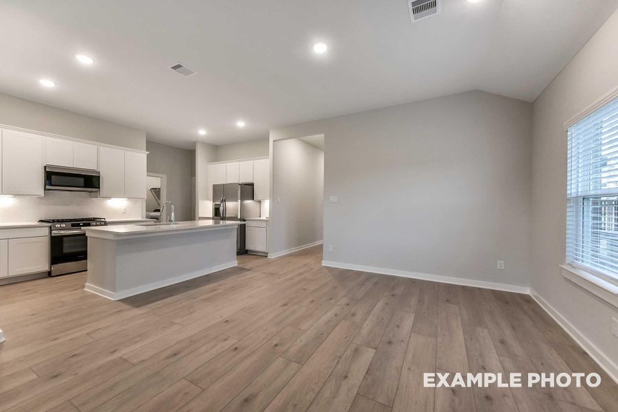 Furnished interior view inside a new home in Sunterra, Katy (Image 7).