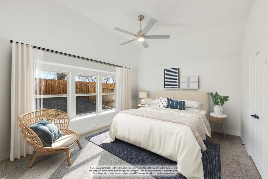 Bedroom with vaulted ceiling, ceiling fan, carpet flooring, and large windows with white curtains