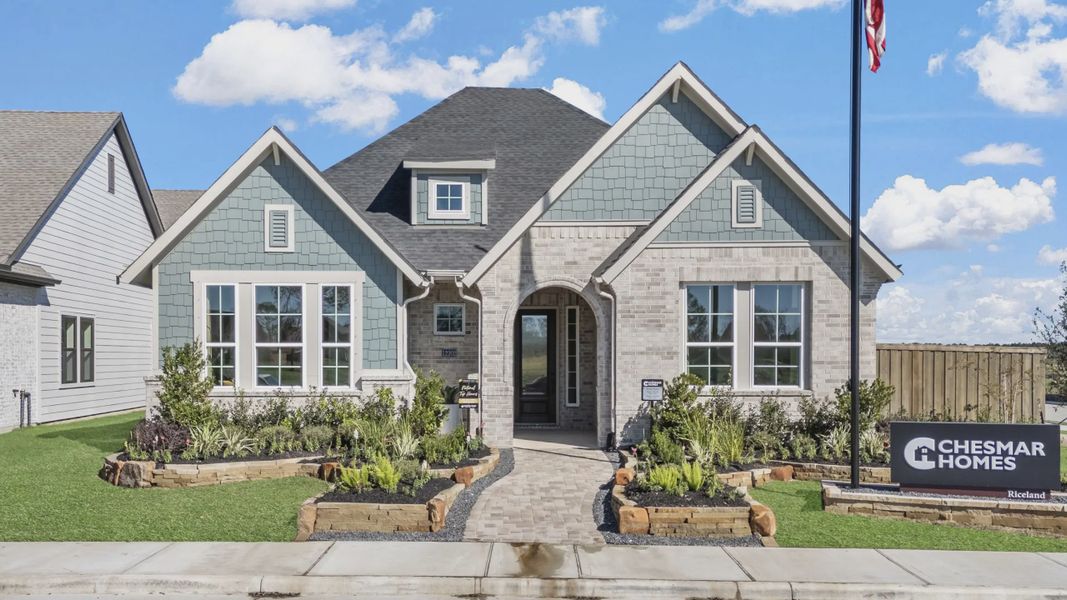 Representative exterior photo of a completed home built from the Nicklaus by Chesmar Homes in Riceland Alley Loads, Mont Belvieu, TX (Image 33).