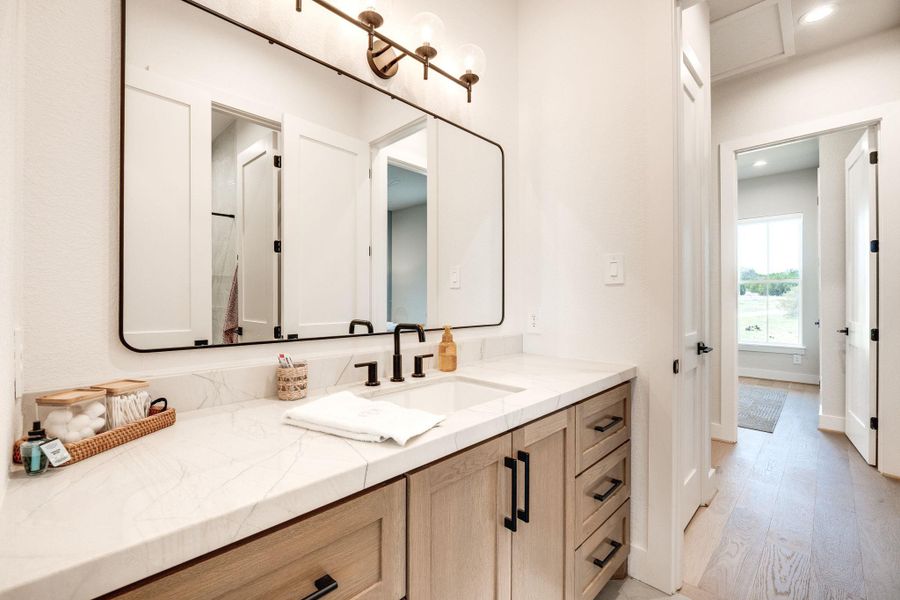 Bathroom featuring vanity, light wood-type flooring, and recessed lighting
