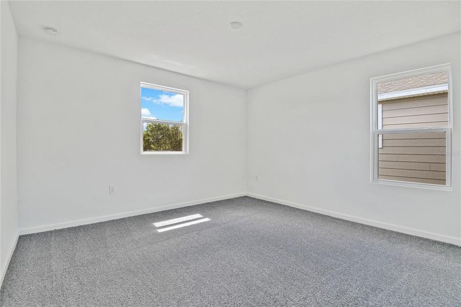 Spacious, unfurnished interior of a new home in Seasons at Shores of Lake Dell, Dundee (Image 19).
