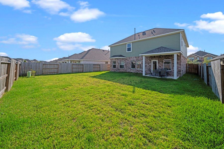 Front exterior of a new home in Marvida, Cypress, TX, highlighting curb appeal (Image 26). Front exterior of a new home in Marvida, Cypress, TX, highlighting curb appeal (Image 26).