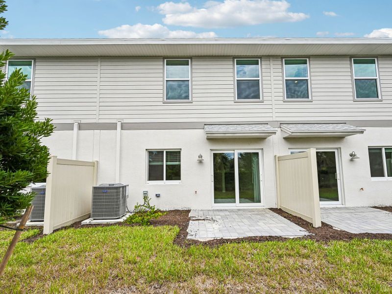 Exterior details and patio area of a home in Meritage Homes at Central Park, Port St. Lucie (Image 4).