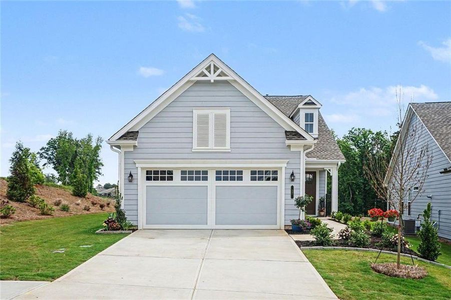 Front exterior of a new home in , Hoschton, GA, highlighting curb appeal (Image 23).