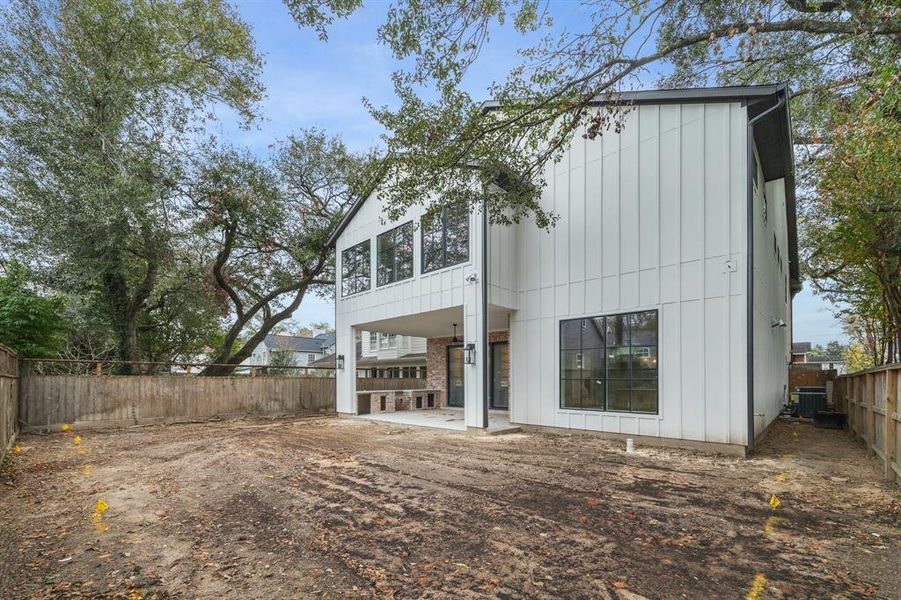 Rear elevation of the home, with room for a pool.  Photos as of Jan. 13th, 2025.