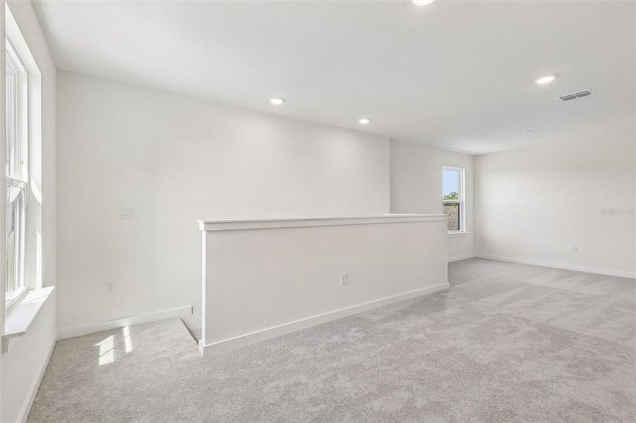 Spacious, unfurnished interior of a new home in Grasslands West, Lakeland (Image 20).