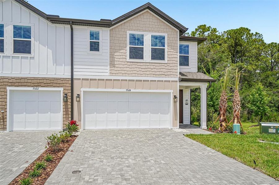 Front exterior of a new home in Montague Chase, Tampa, FL, highlighting curb appeal (Image 24). Front exterior of a new home in Montague Chase, Tampa, FL, highlighting curb appeal (Image 24).