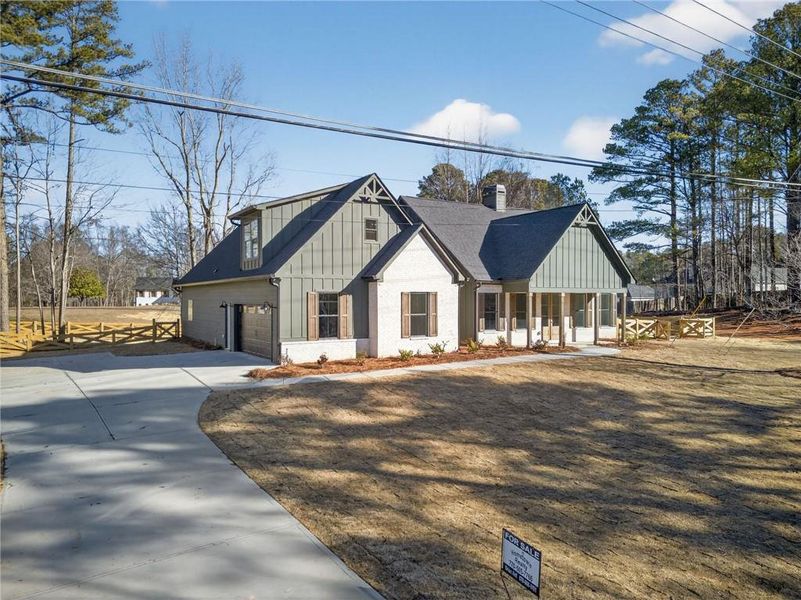 Front exterior of a new home in , Douglasville, GA, highlighting curb appeal (Image 23).