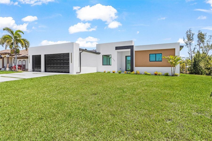 Front exterior of a new home in , Cape Coral, FL, highlighting curb appeal (Image 20).