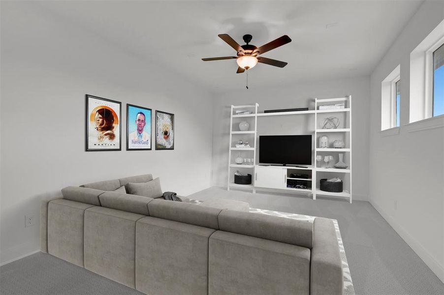 This living space features light-colored walls and carpeting, creating a bright atmosphere