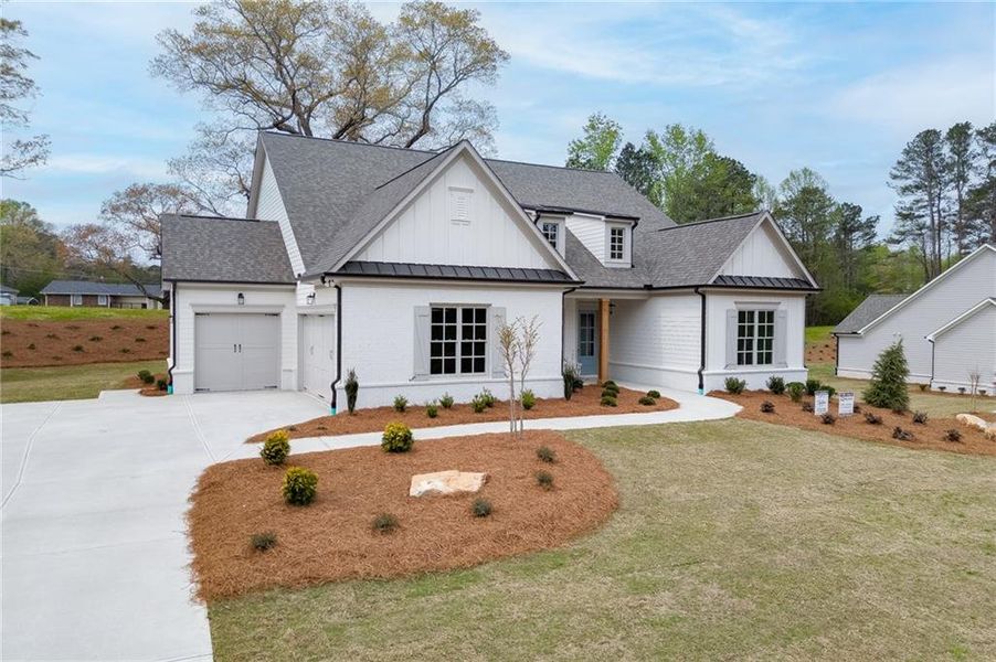 Front exterior of a new home in , Cumming, GA, highlighting curb appeal (Image 24).