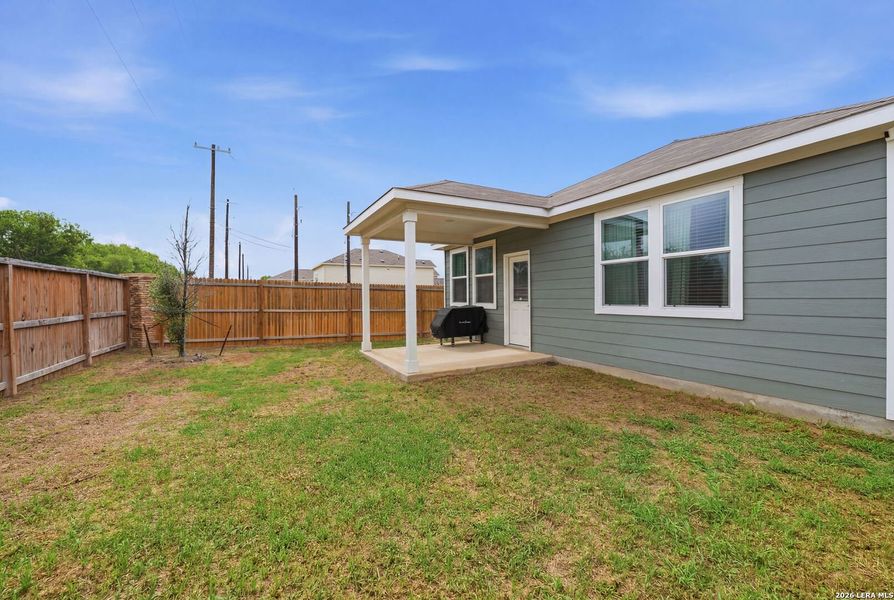 Exterior details and patio area of a home in Spring Creek, San Antonio (Image 30).