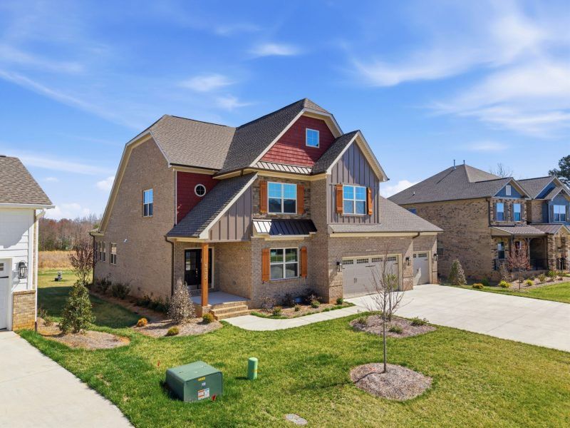 Representative exterior photo of a completed home built from the Hampton by Keystone Homes NC in Preserve at Carriage Cove, Oak Ridge, NC (Image 44).