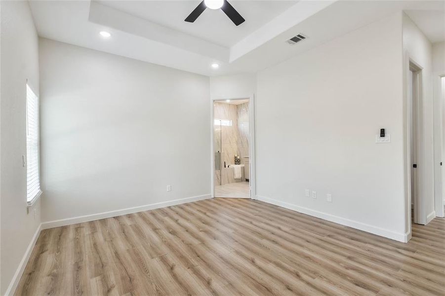 Ceiling fan in large Primary Bedroom Suite.