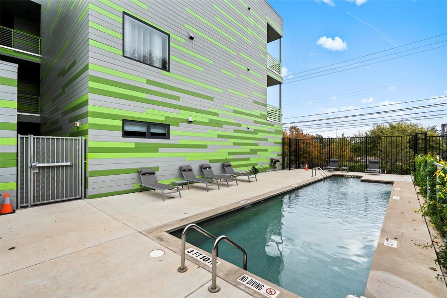 Pool featuring a patio and fence