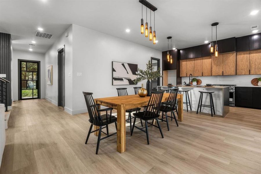 Dining area featuring recessed lighting and light wood finished floors