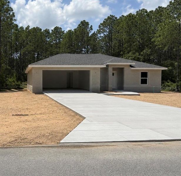 Front exterior of a new home in , Dunnellon, FL, highlighting curb appeal (Image 1). Front exterior of a new home in , Dunnellon, FL, highlighting curb appeal (Image 1).