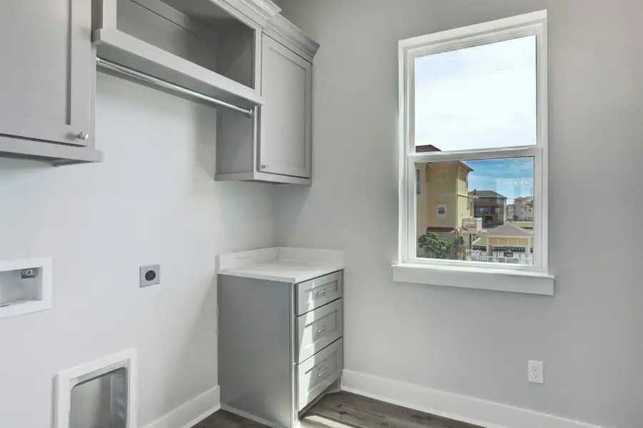 Utility room with window overlooks the front side of the home, and comes complete with custom cabinetry & a separate storage closet. Utility room with window overlooks the front side of the home, and comes complete with custom cabinetry & a separate storage closet.