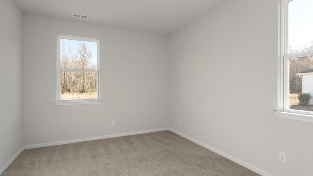 Spacious, unfurnished interior of a new home in Indigo Preserve, Leland (Image 24).