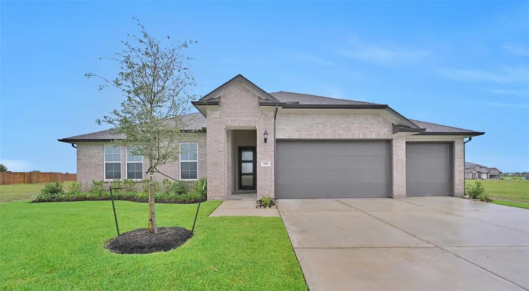 Front exterior of a new home in Lago Mar, Texas City, TX, highlighting curb appeal (Image 1).