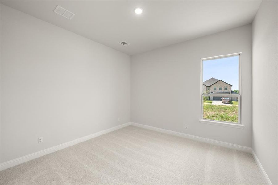 Empty room featuring light colored carpet and recessed lighting Empty room featuring light colored carpet and recessed lighting