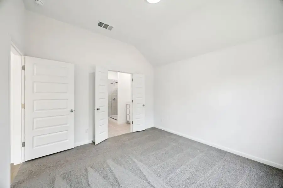 Primary Suite in the Spruce home plan by Trophy Signature Homes - REPRESENTATIVE PHOTO