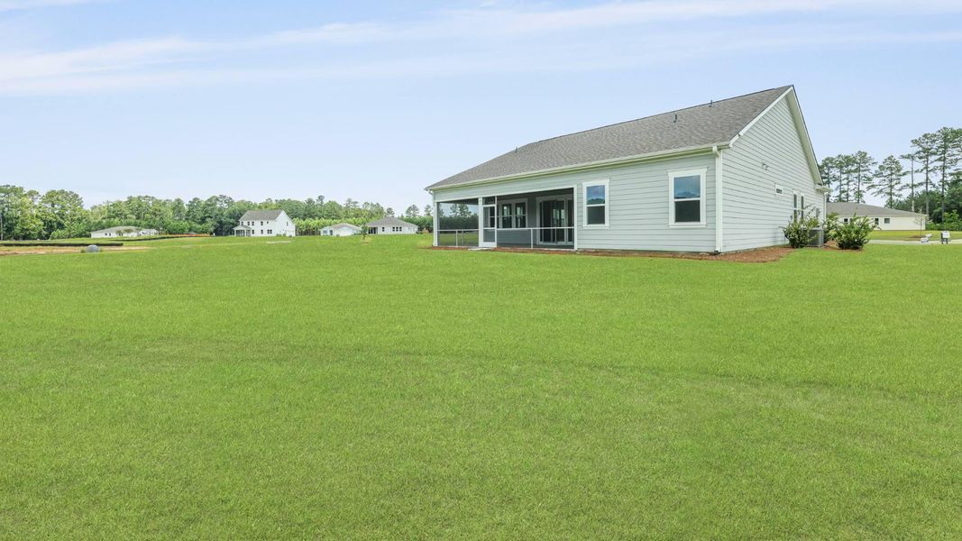Front exterior of a new home in Berkeley Bay, Ridgeville, SC, highlighting curb appeal (Image 2).