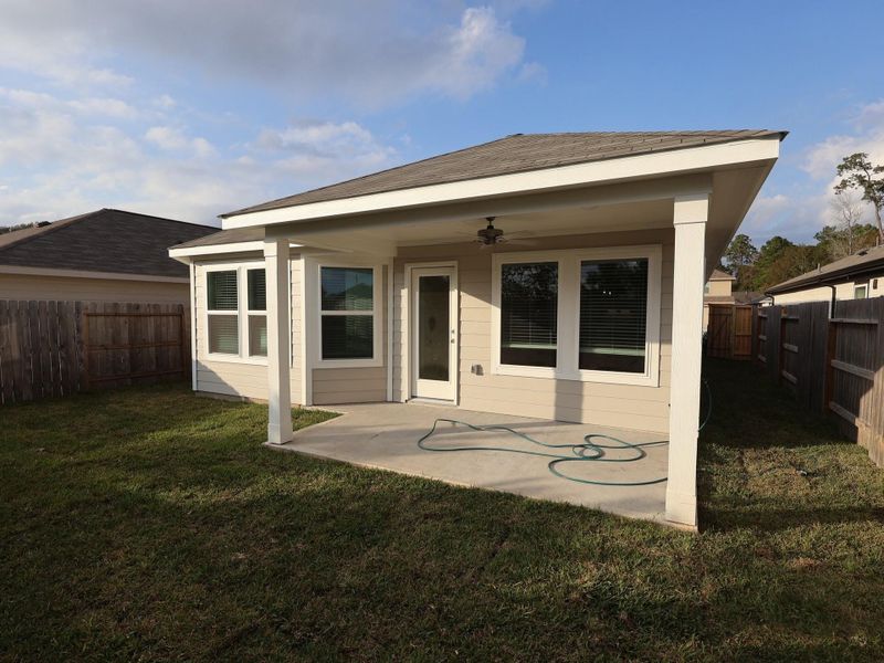 Exterior details and patio area of a home in Pinewood at Grand Texas, New Caney (Image 3).