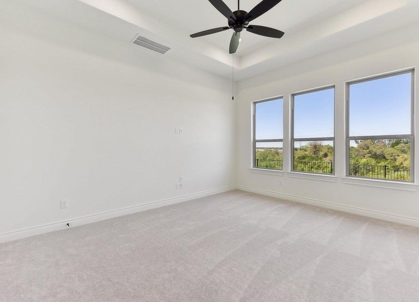Unfurnished room with visible vents, baseboards, a ceiling fan, and light carpet Unfurnished room with visible vents, baseboards, a ceiling fan, and light carpet