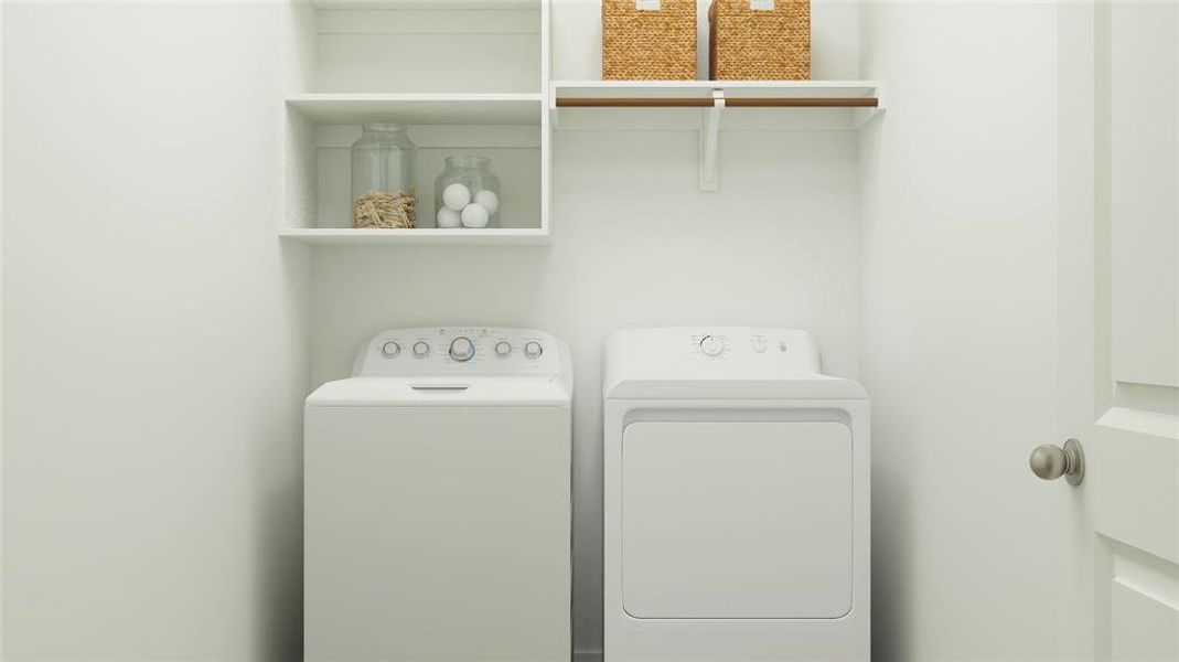 Clothes washing area featuring separate washer and dryer